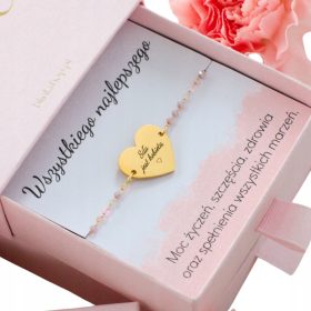    Un braccialetto per un'amica con un regalo inciso, un cuore in acciaio placcato oro
