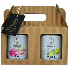    Un set regalo di due mieli in una scatola: miele al lampone e miele allo zenzero e limone